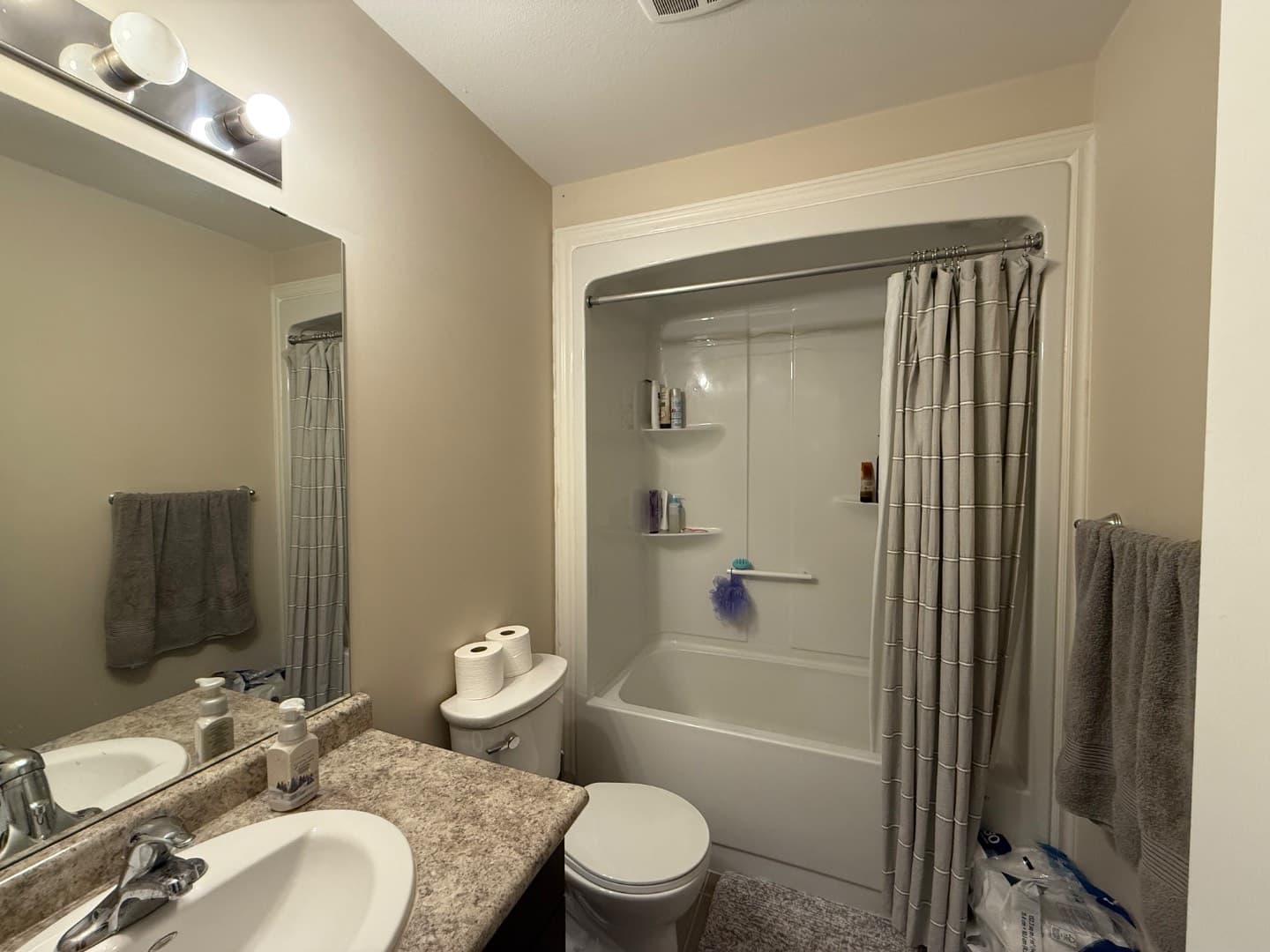 Full bathroom with tub, shower and vanity